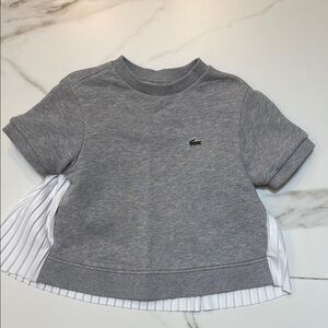 Girls Lacoste crew sweatshirt with pleated back.